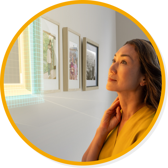 Woman looking at an empty picture frame on a wall