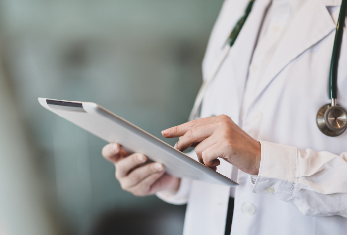 Healthcare provider using a tablet.
